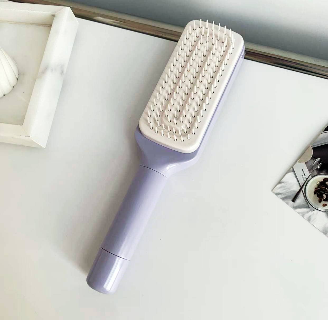 Brosse à cheveux autonettoyante